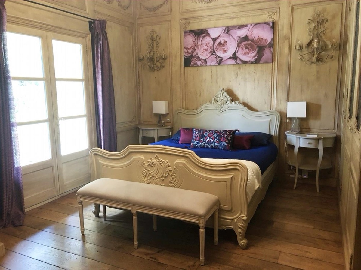 Double bedroom with pink painting at Mas Laurent in Provence