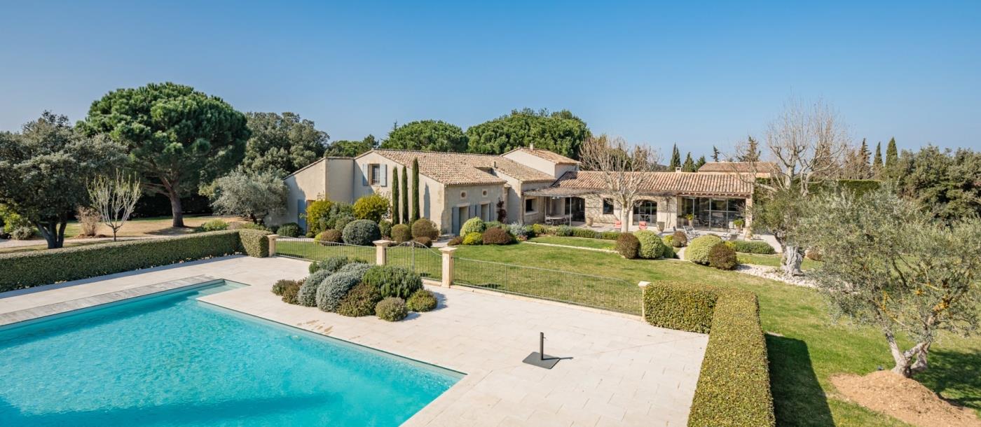 Pool and garden with exterior of property at Mas Laurent in Provence