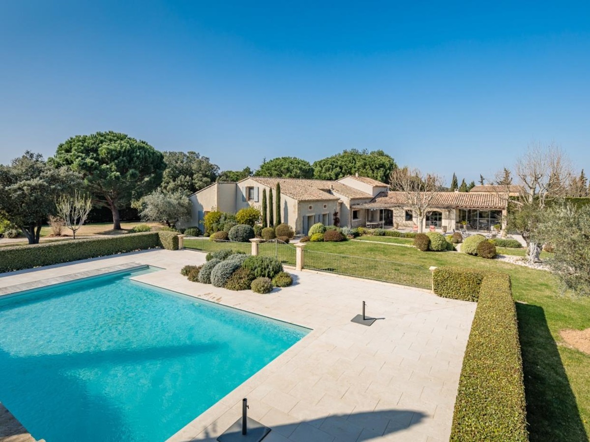 Pool and garden with exterior of property at Mas Laurent in Provence