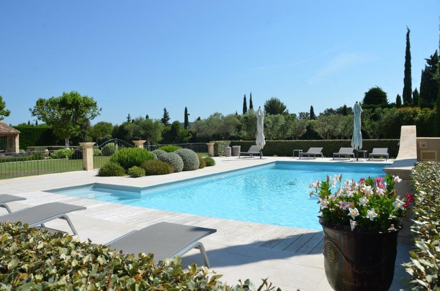 Pool length with garden at Mas Laurent in Provence