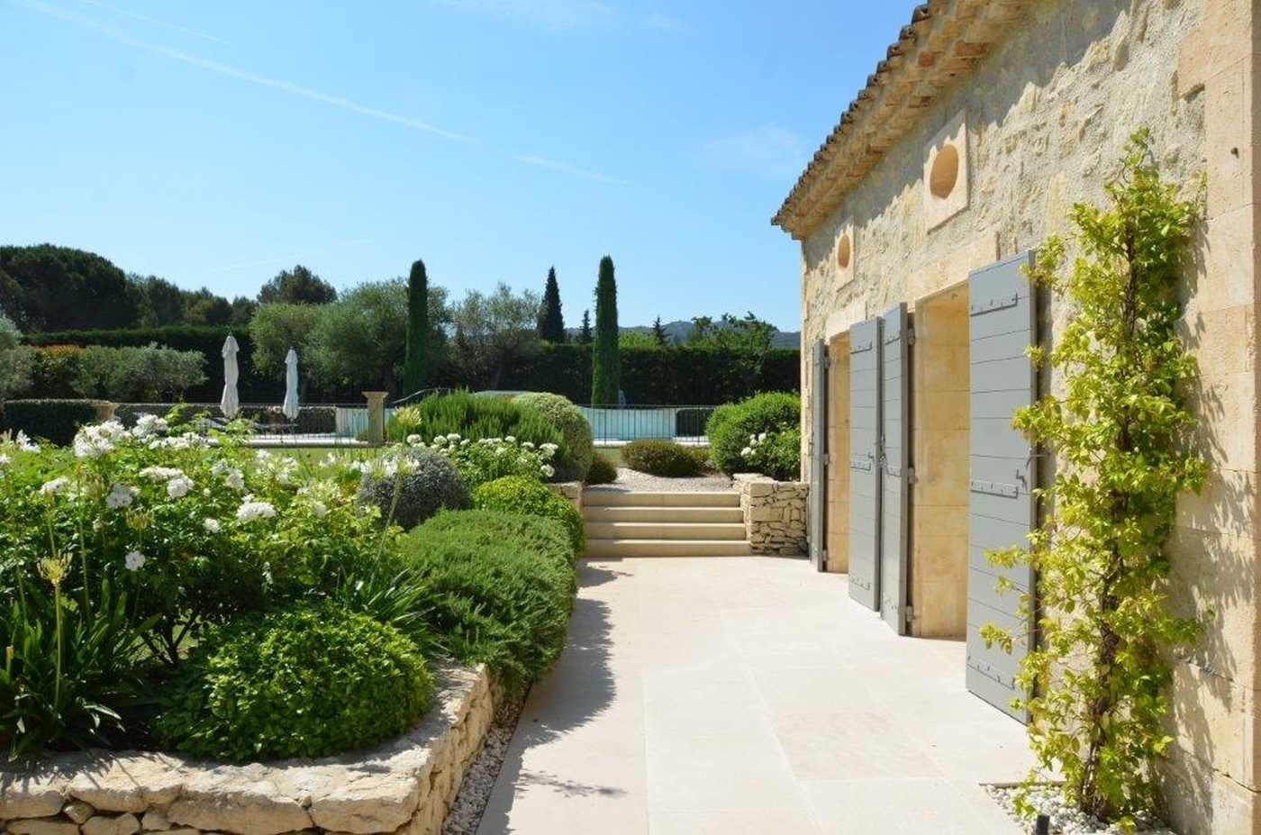 Exterior of property with stone courtyard at Mas Laurent in Provence