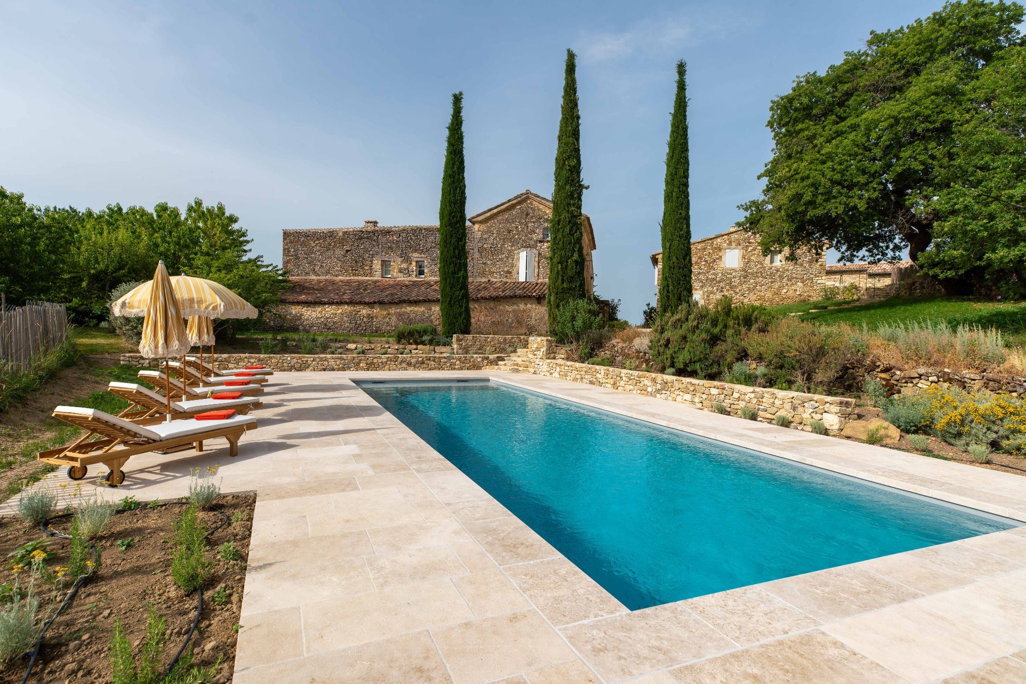 Pool with sun loungers at Villa Thyme