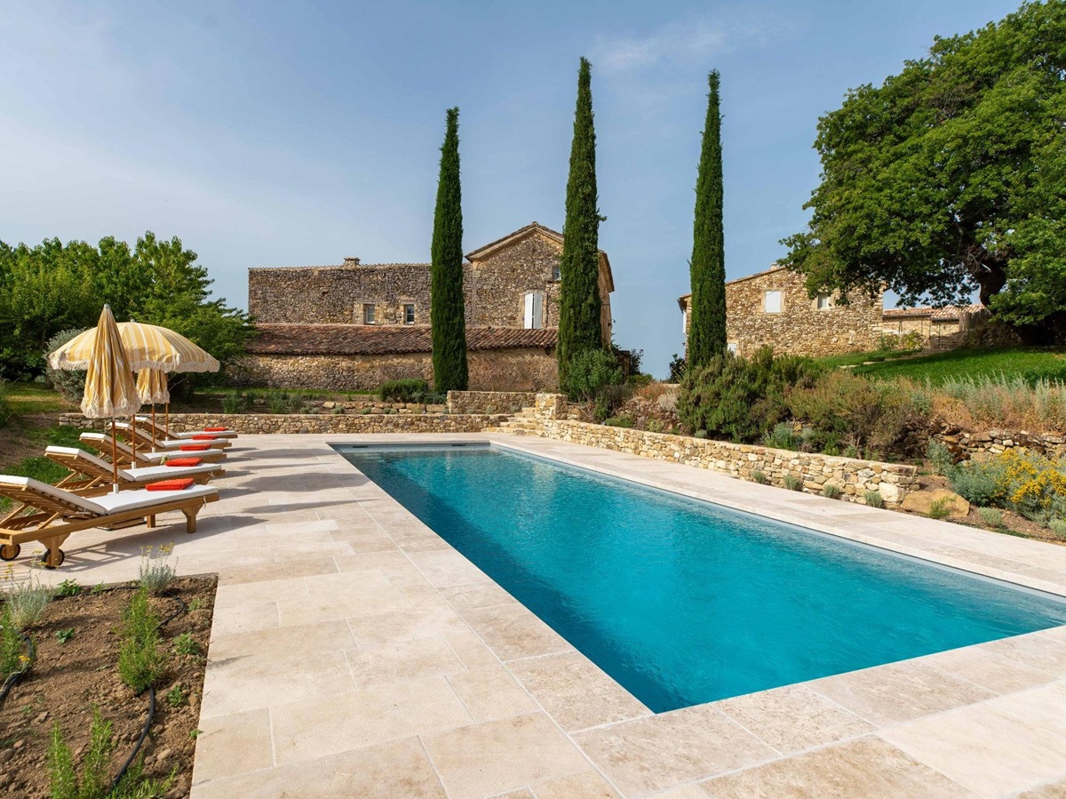 Pool with sun loungers at Villa Thyme