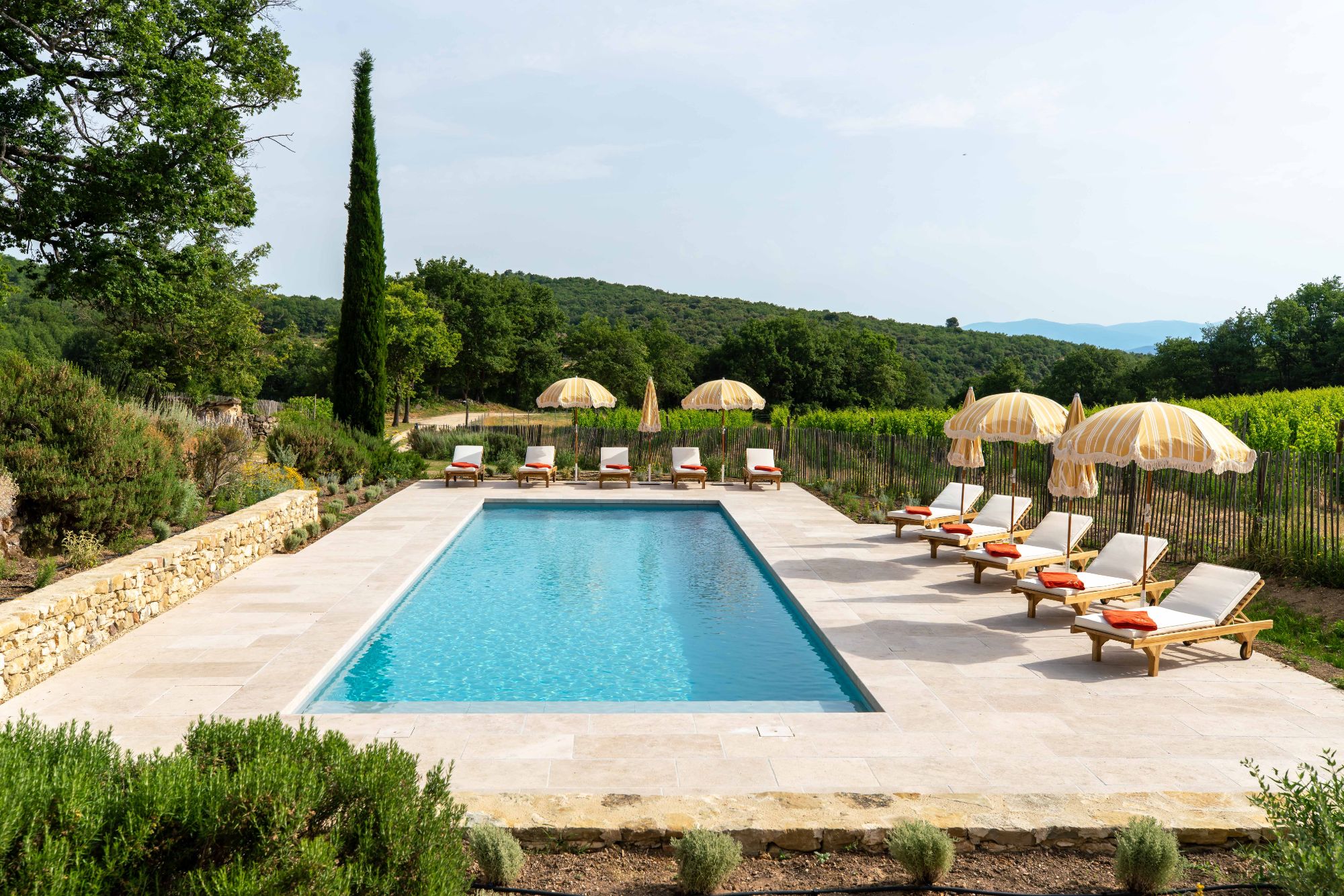 Pool with sun loungers at Villa Thyme