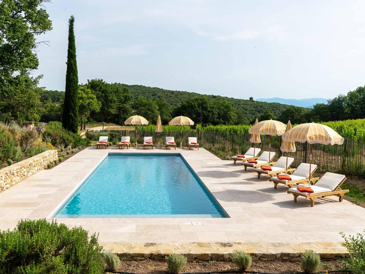 Pool with sun loungers at Villa Thyme