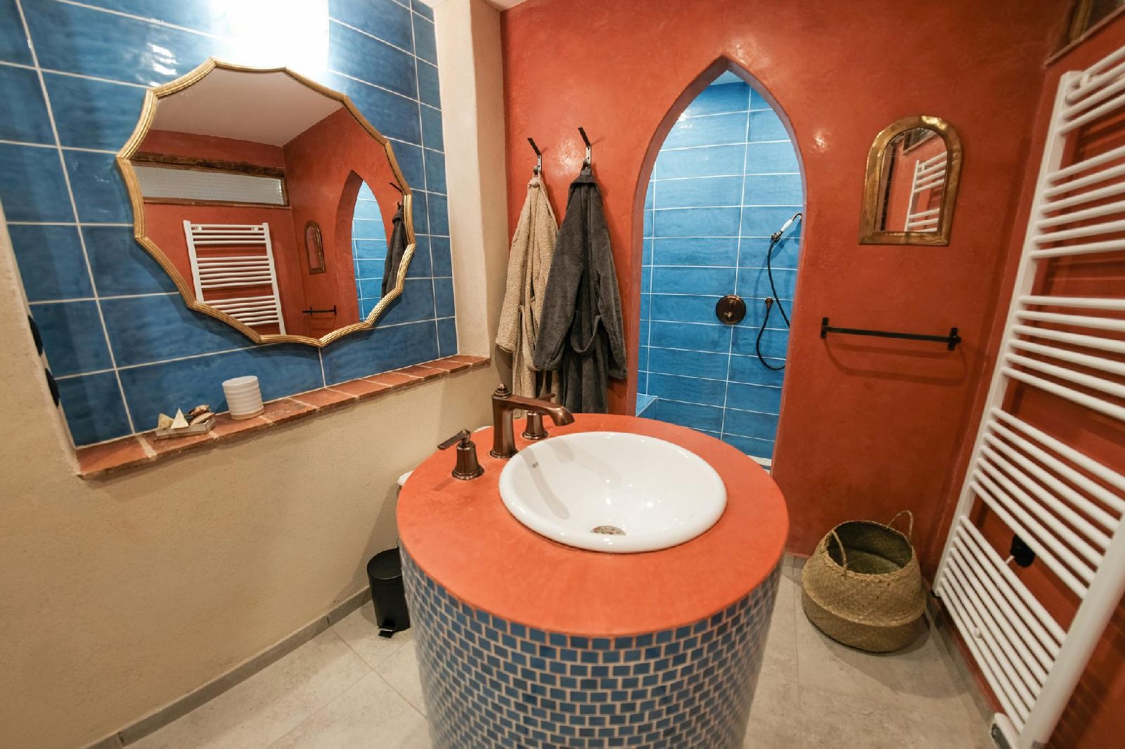 Orange moroccan bathroom at Castelnou in South West France