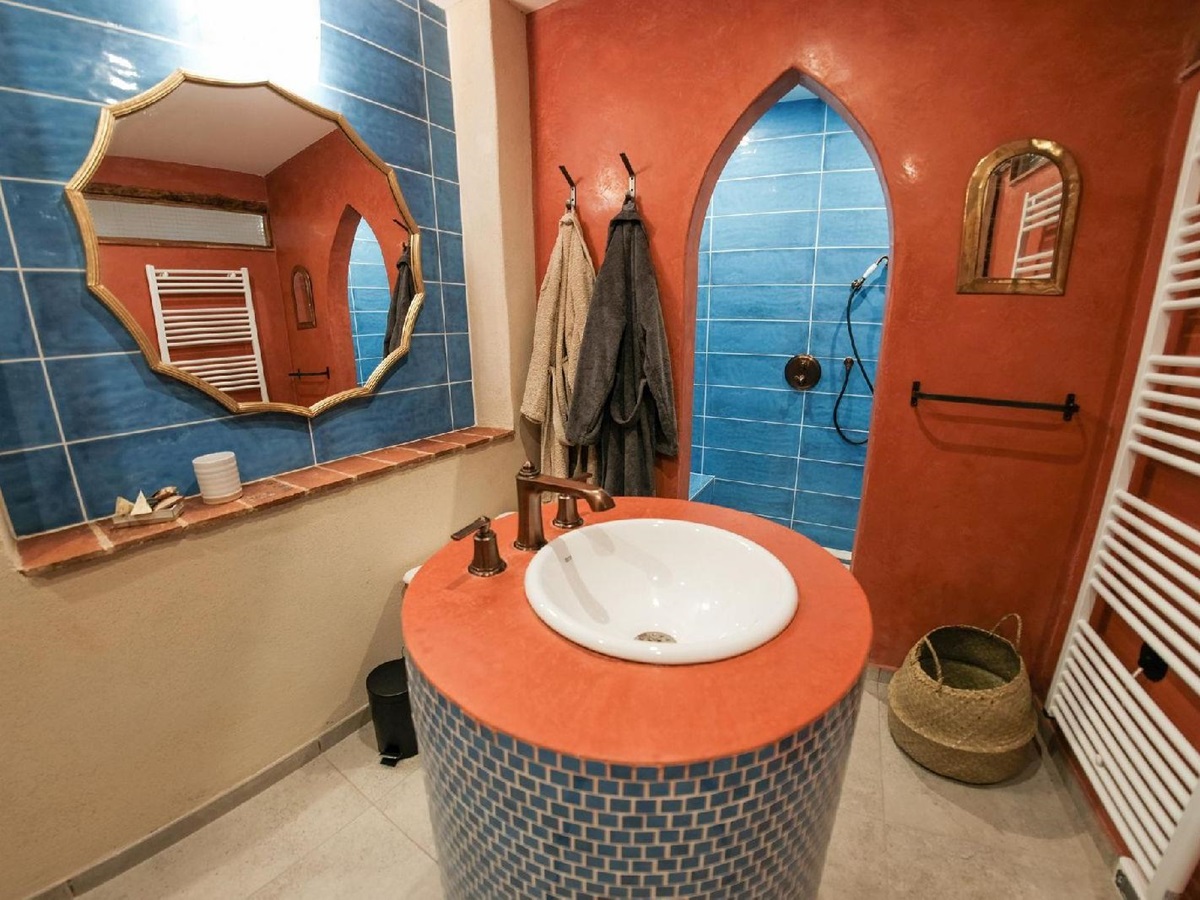 Orange moroccan bathroom at Castelnou in South West France