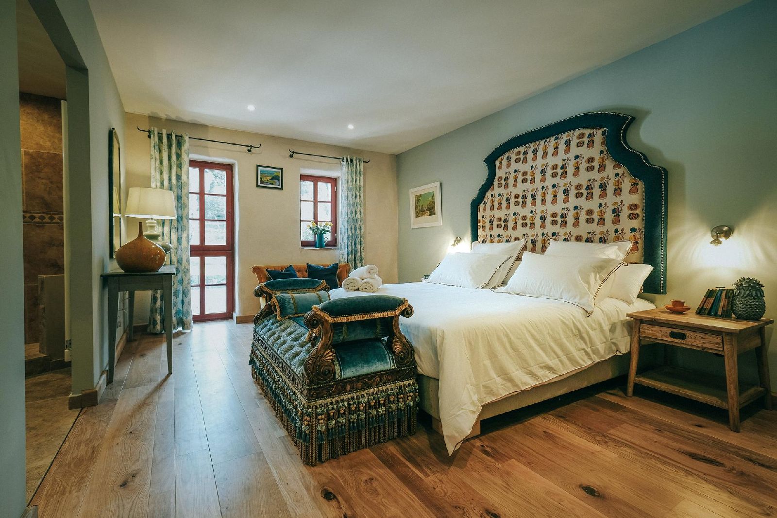Double bedroom with green wall at Castelnou in South West France