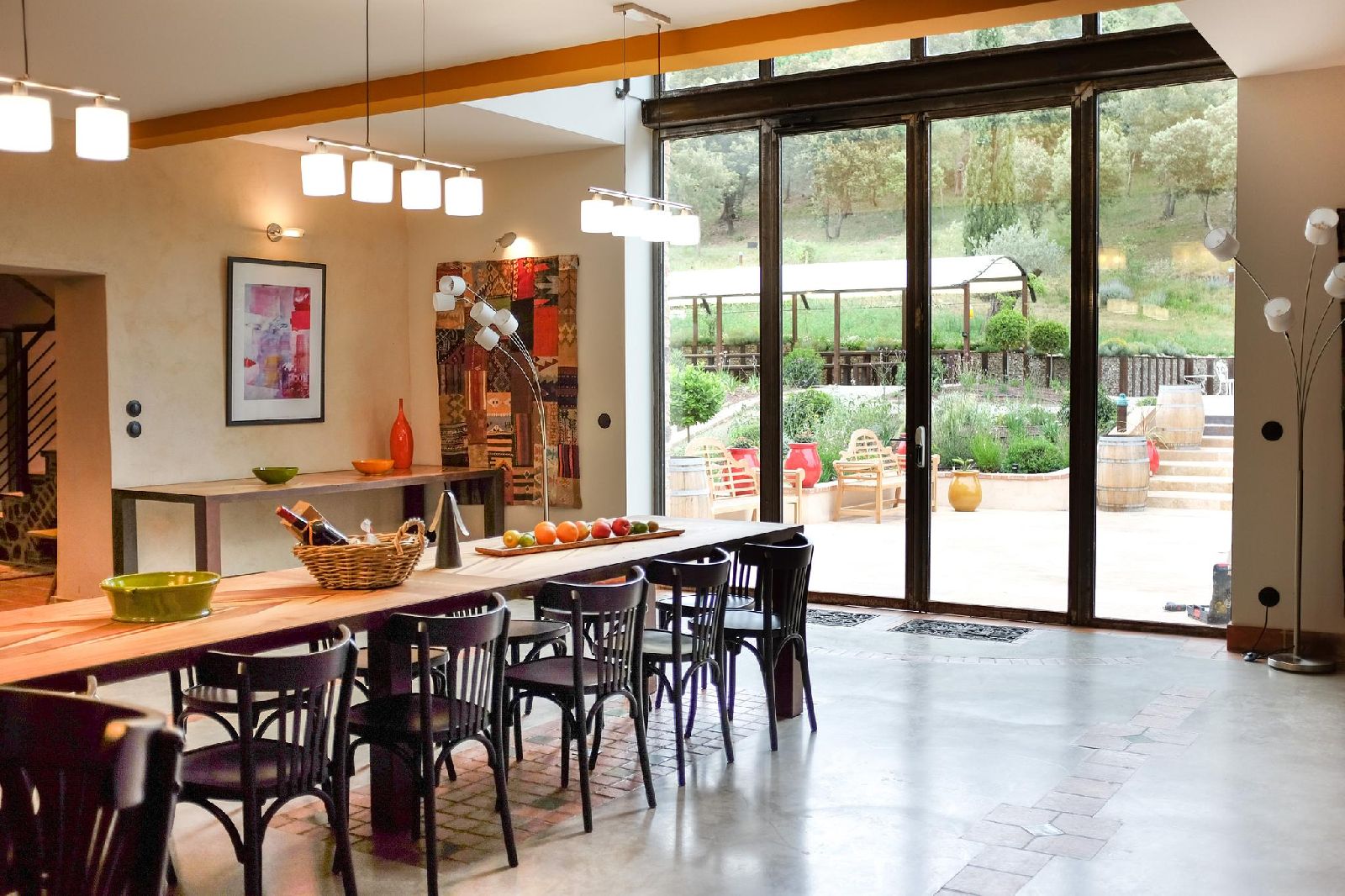 Dining room with floor length windows at Castelnou in South West France