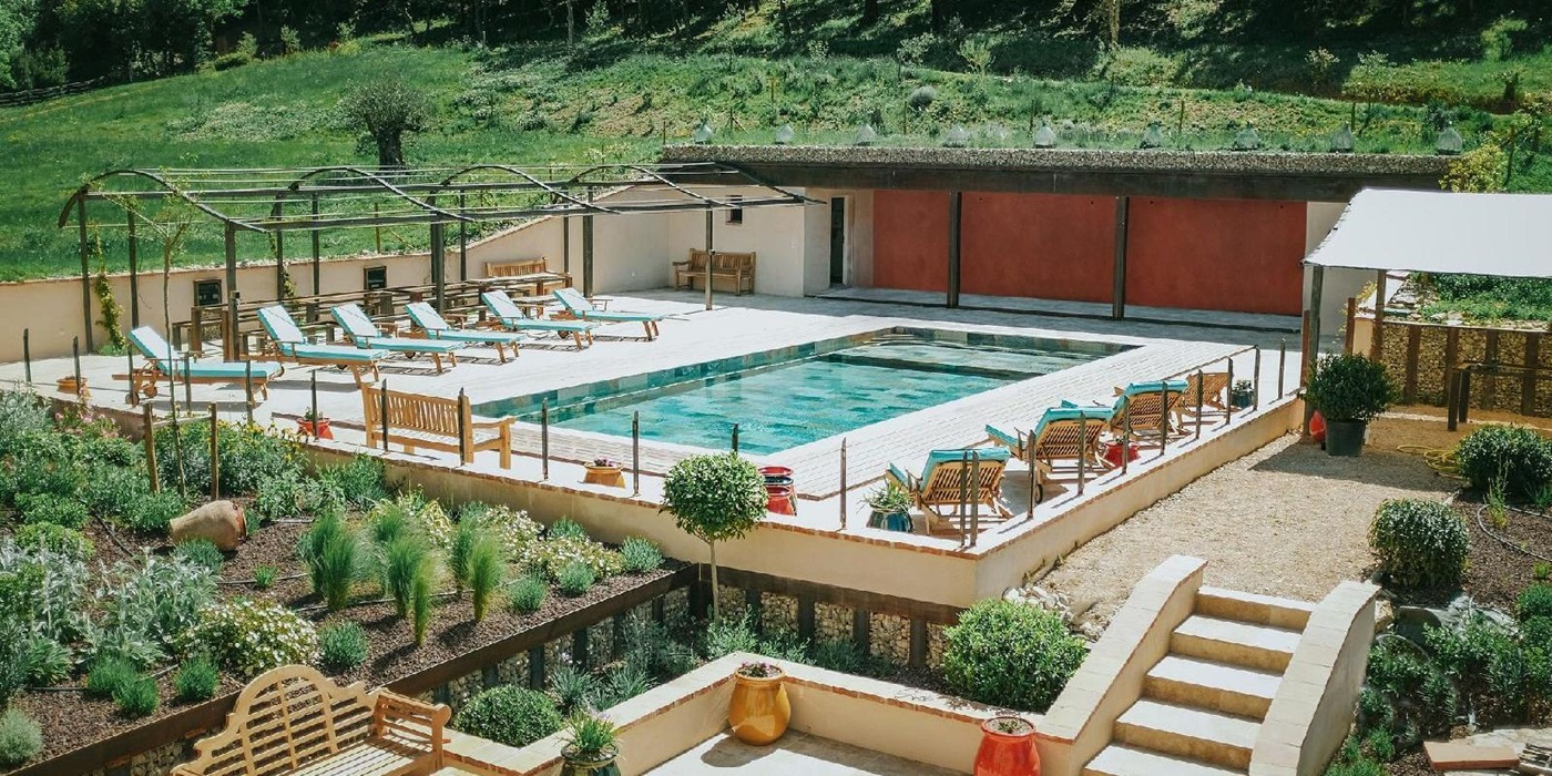 Pool with pool house and seating at Castelnou in South West France