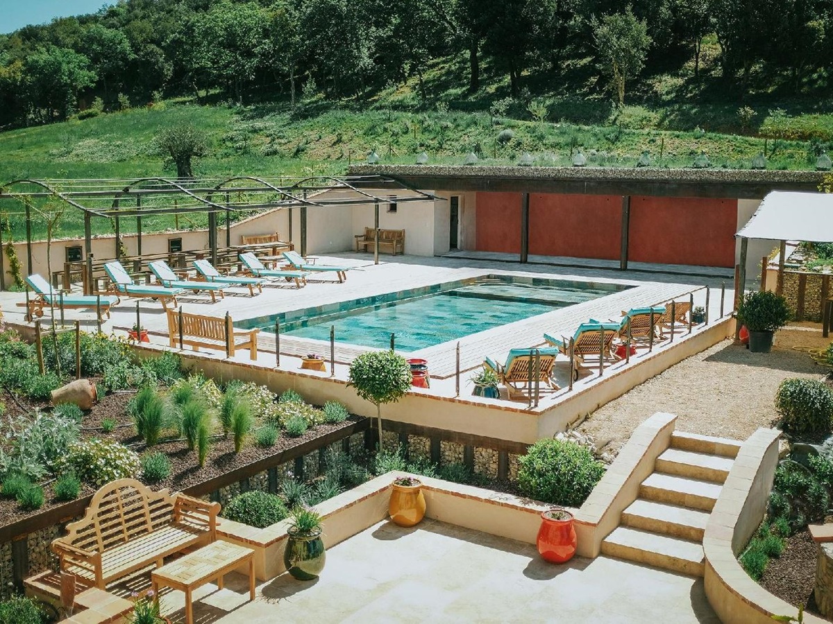 Pool with pool house and seating at Castelnou in South West France