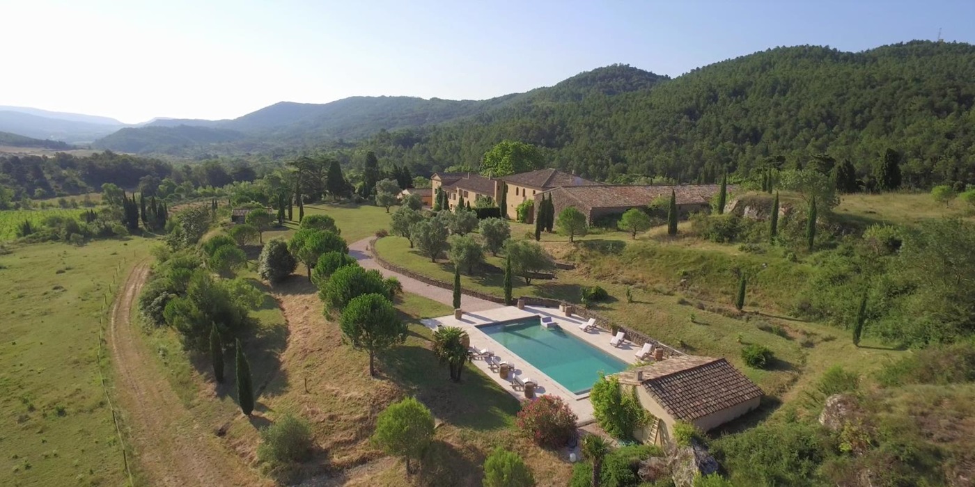 Aerial view of villa, pool and surrounding countryside at Domaine de Corbieres in South West France