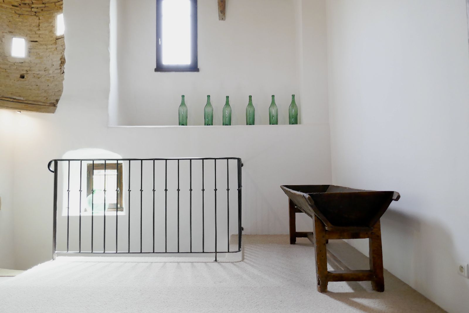 Wooden bench inside at Domaine de la Hille in France