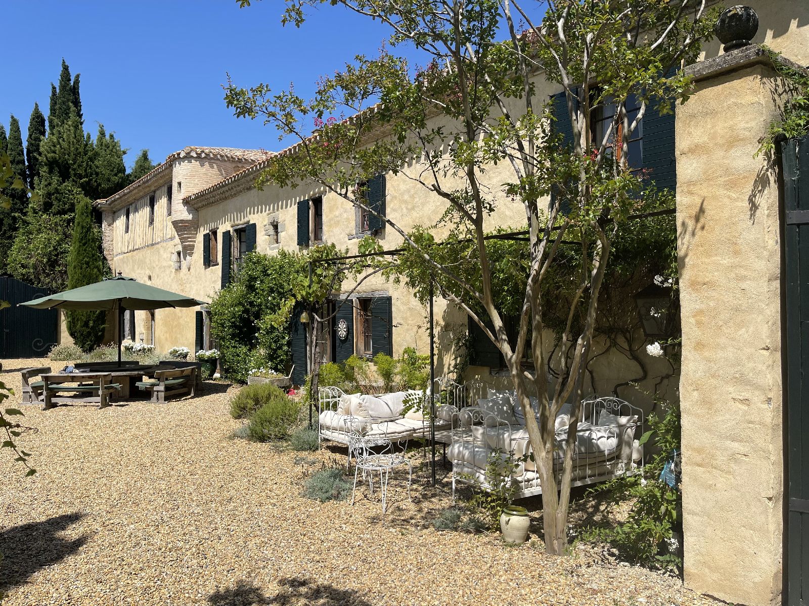 Outdoor seating at villa entrance at Domaine de la Hille in France