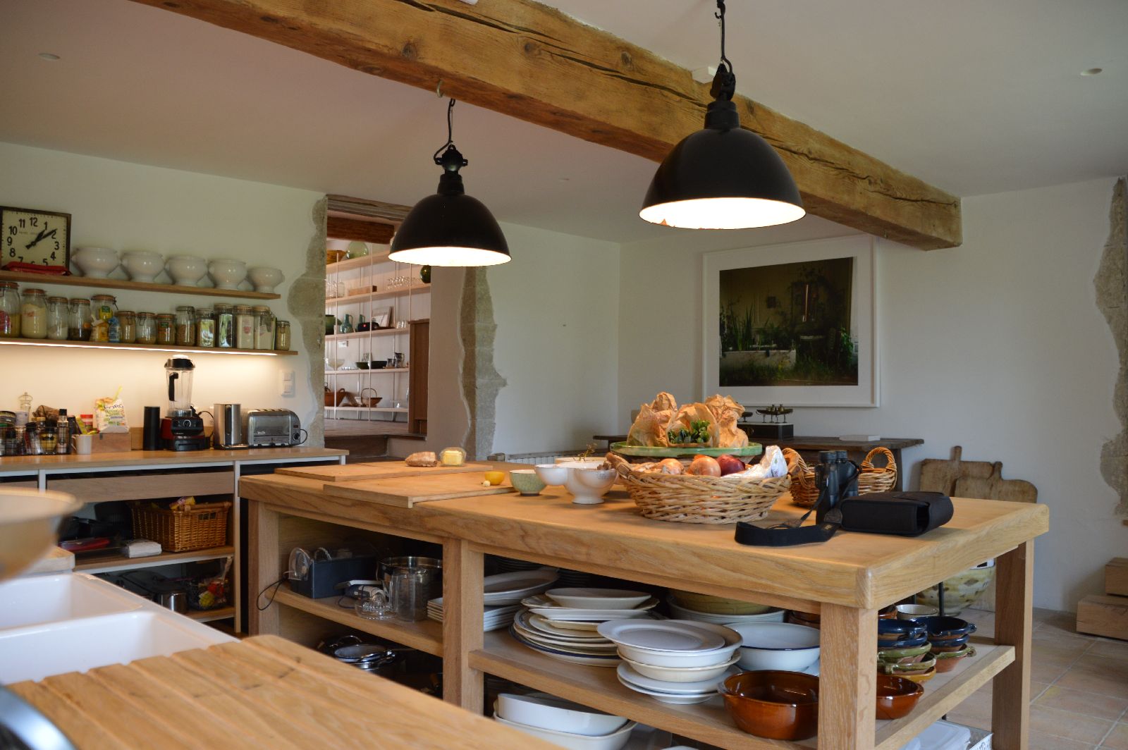 Kitchen with wooden island at Domaine de la Hille in France