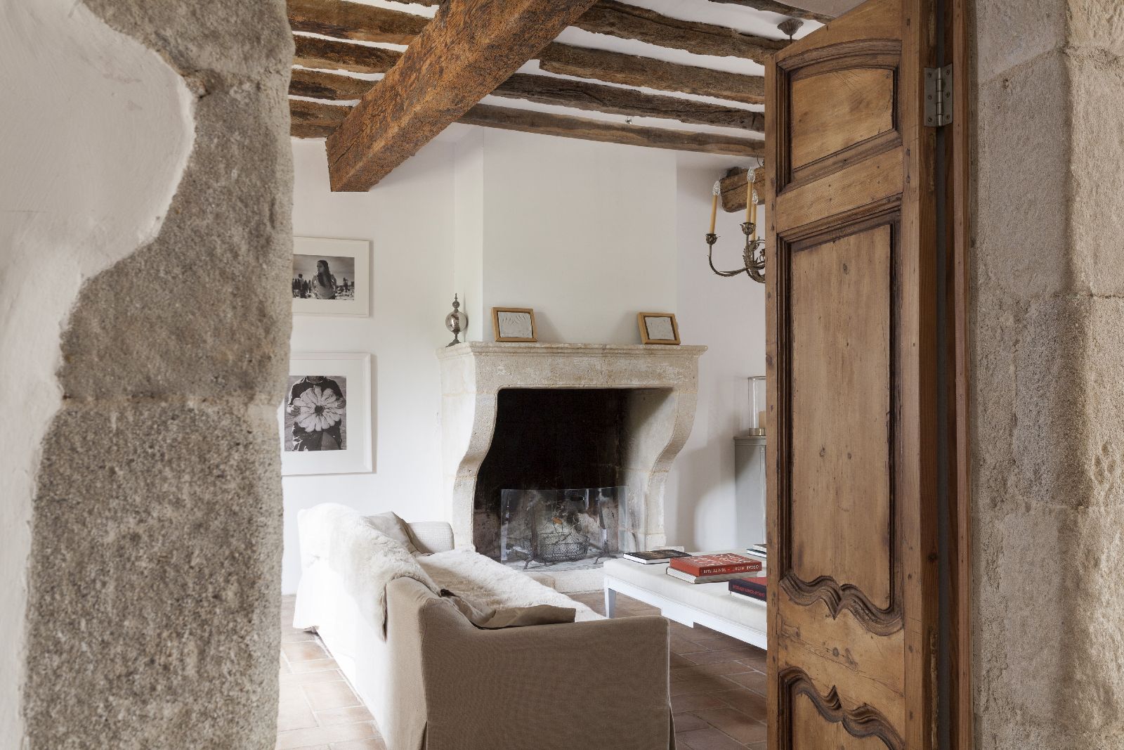 Wooden door leading to living room at Domaine de la Hille in France