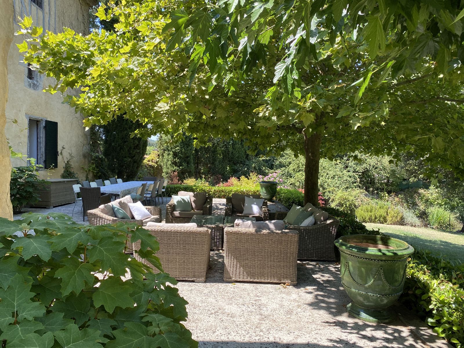 Shaded seating at front of villa at Domaine de la Hille in France
