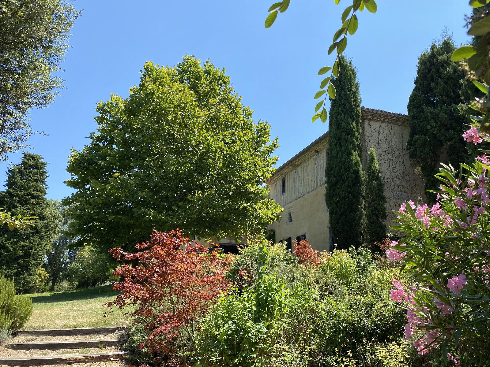 Steps to side of house with garden at Domaine de la Hille in France