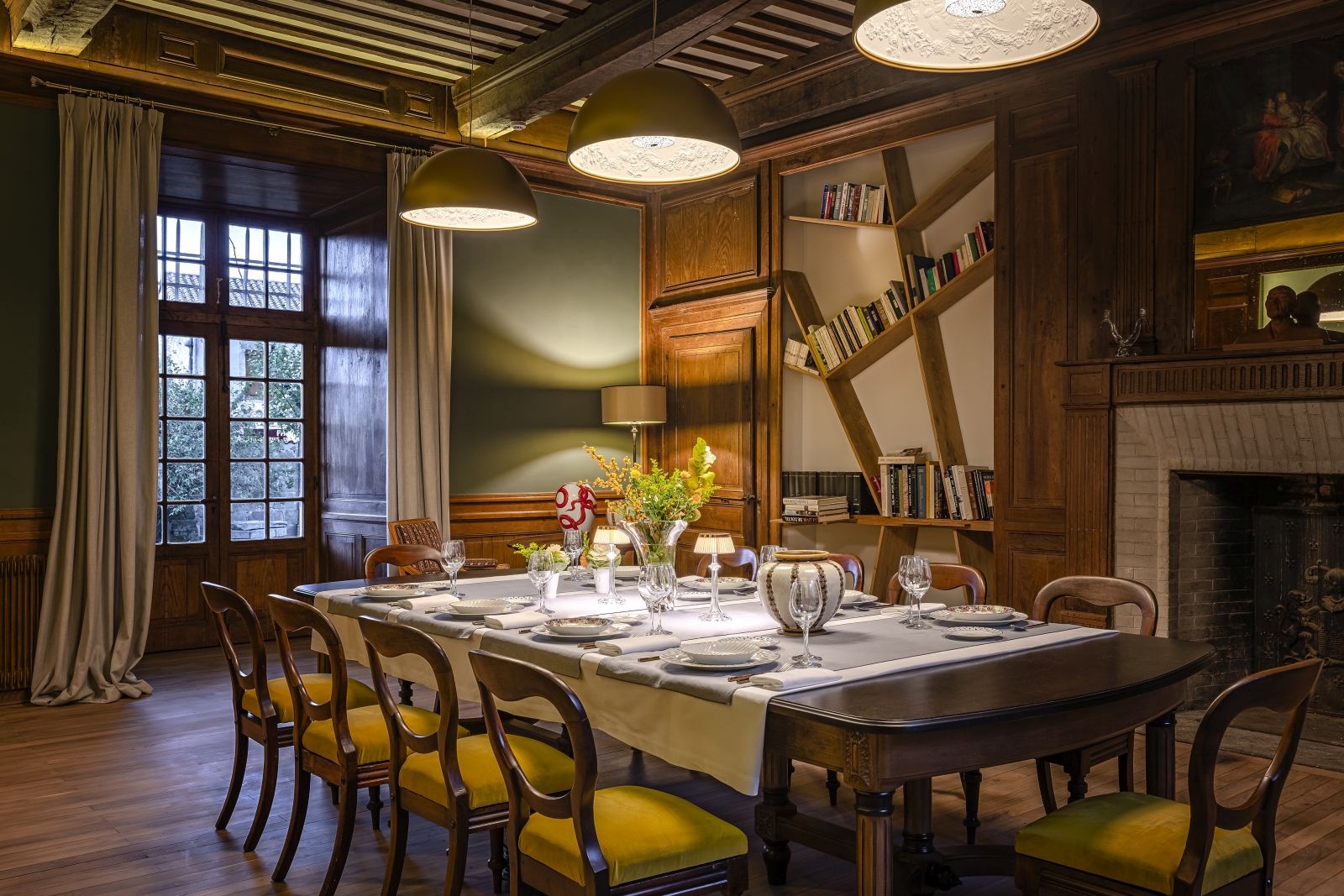 Dining room with overhead lighting at Le Clos Colombier in France