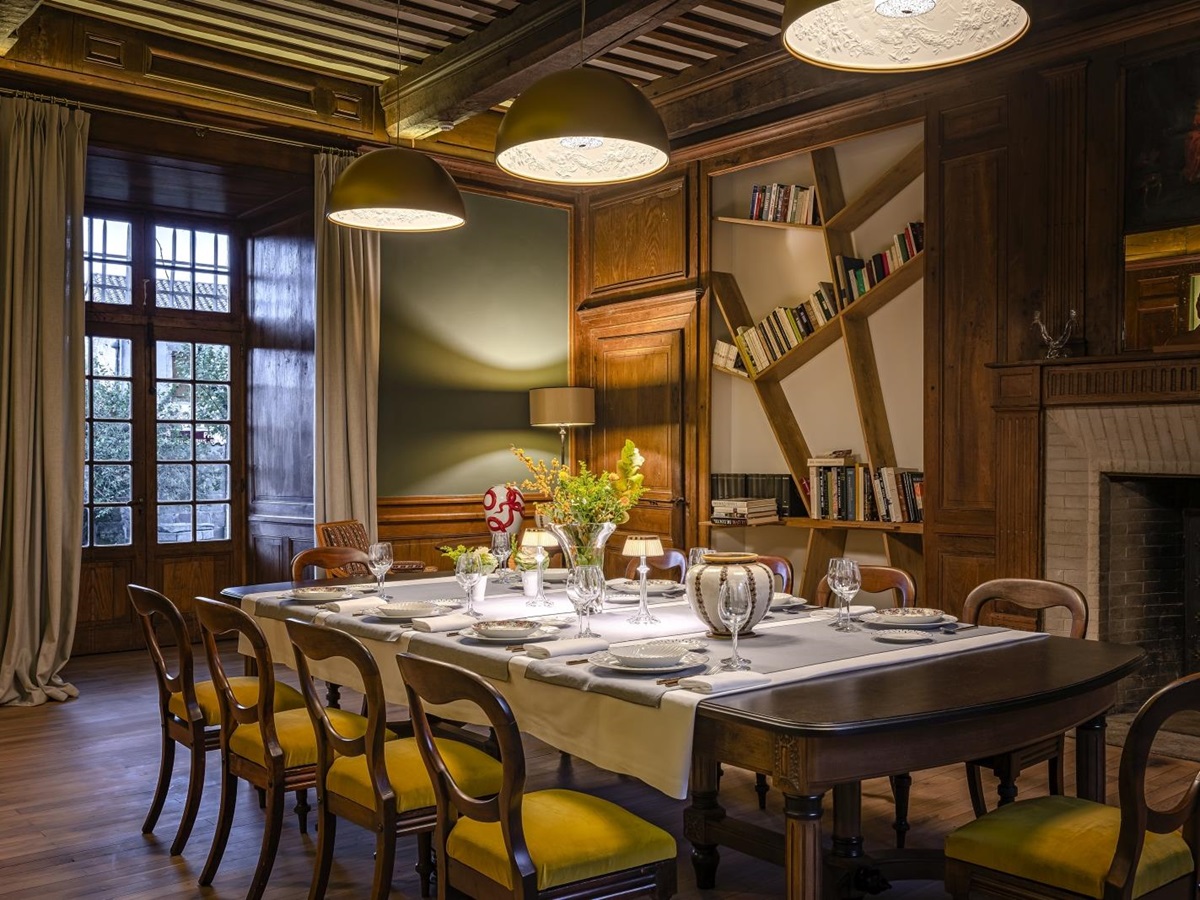 Dining room with overhead lighting at Le Clos Colombier in France