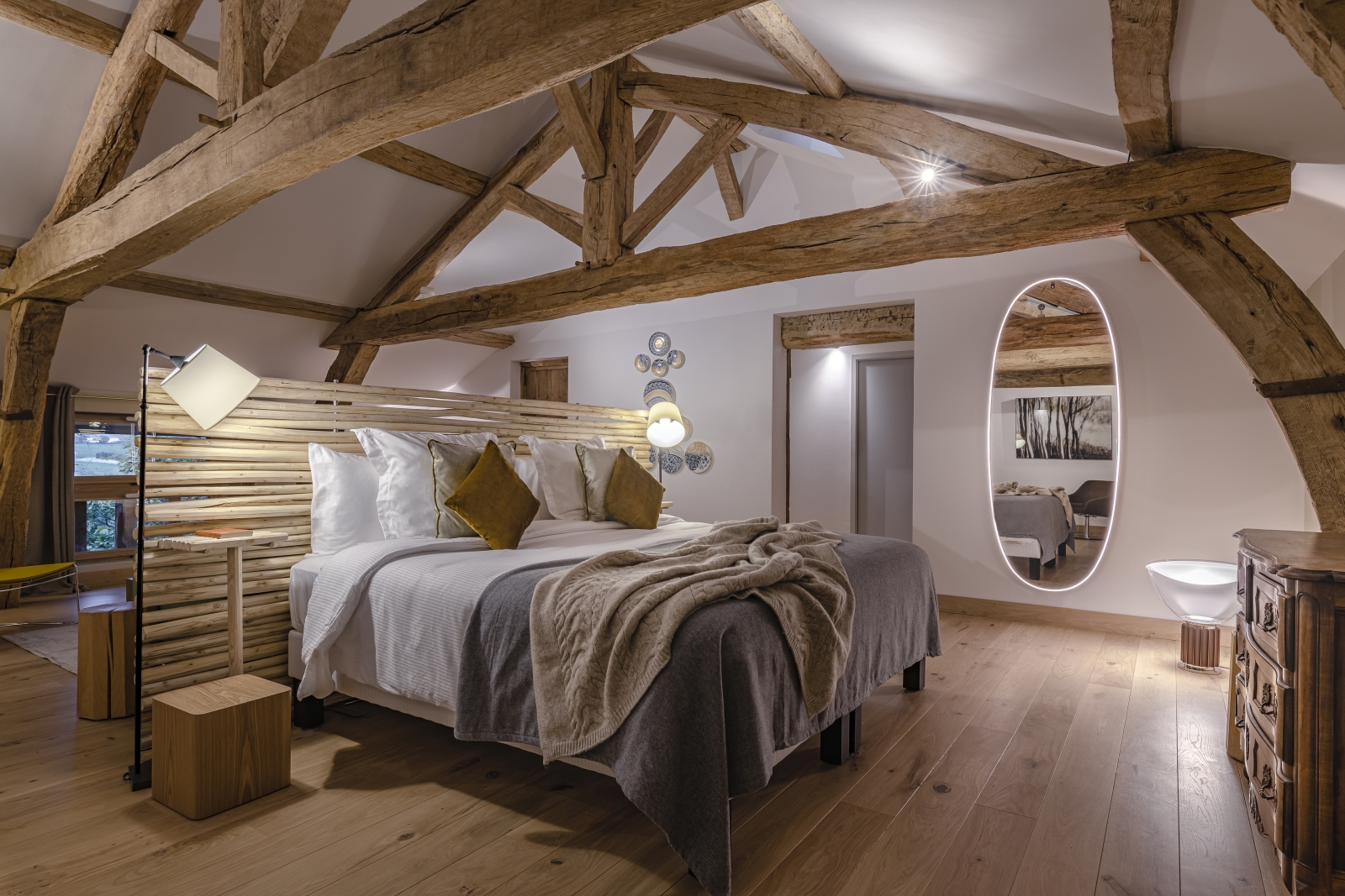 Double bedroom with beamed ceiling at Le Clos Colombier in France