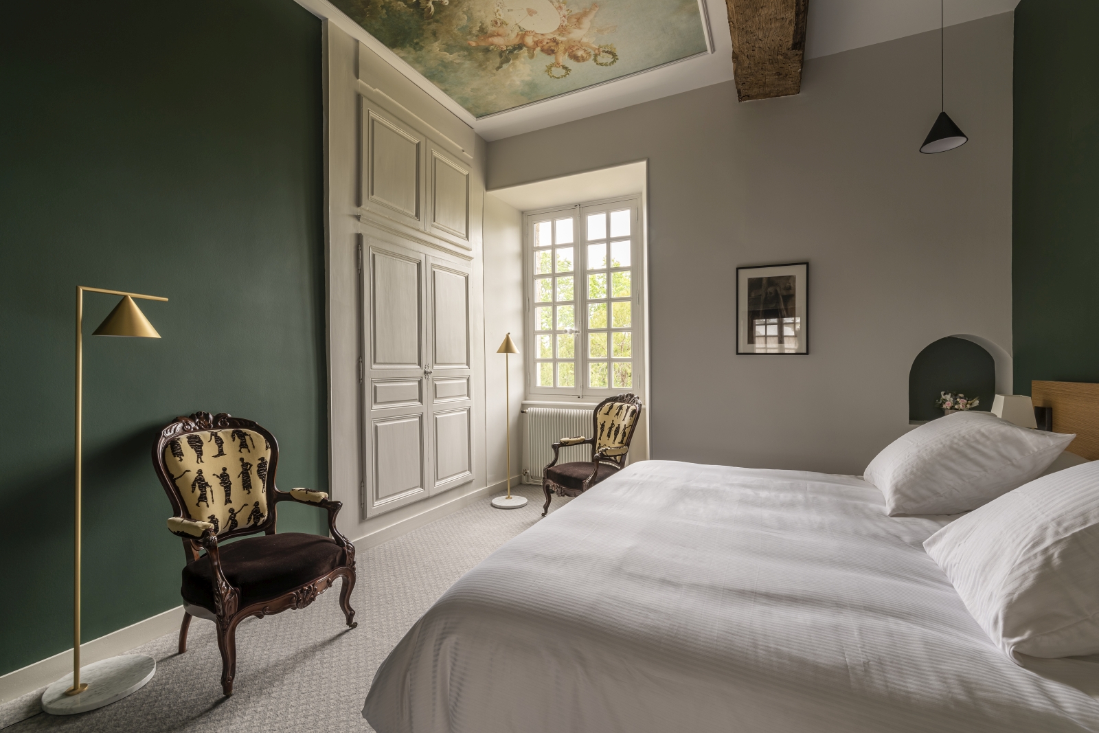 Double bedroom with dark green walls at Le Clos Colombier in France