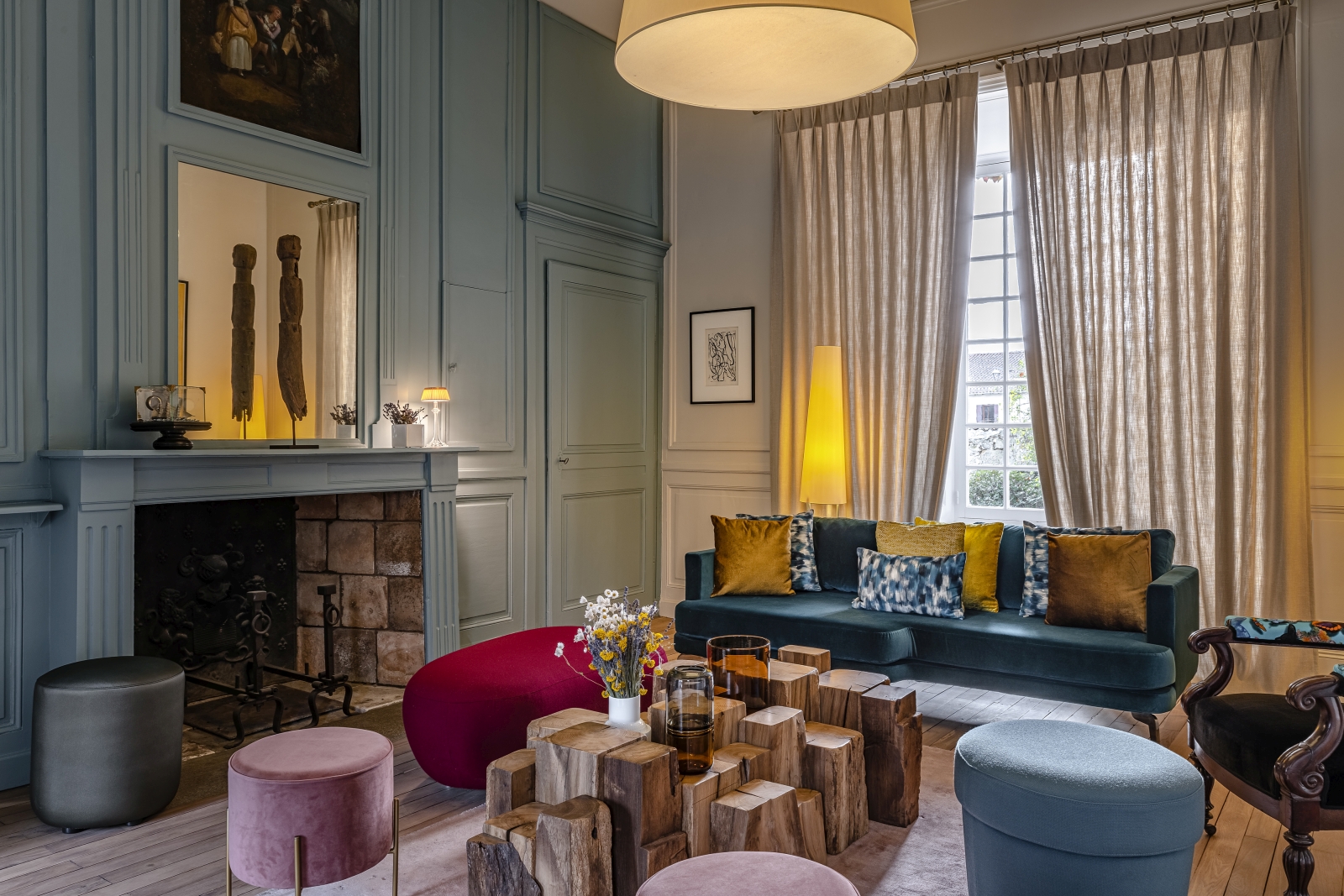 Sitting room with blue sofas and ornate coffee table at Le Clos Colombier in France