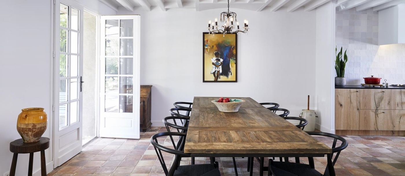 dining room with long wooden table at pomiera, france