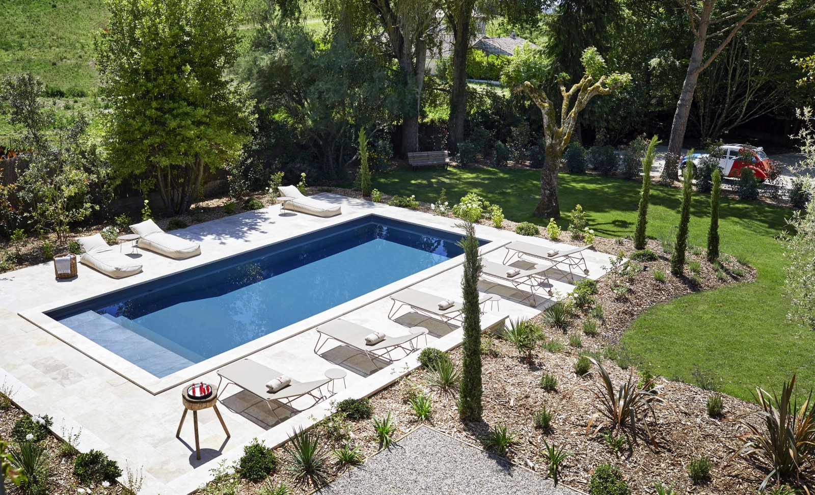 view of pool from villa with loungers at pomiera, france