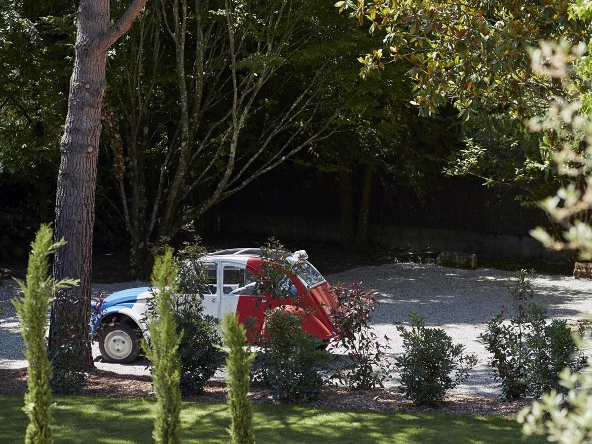 small red and blue car parked at pomiera, france