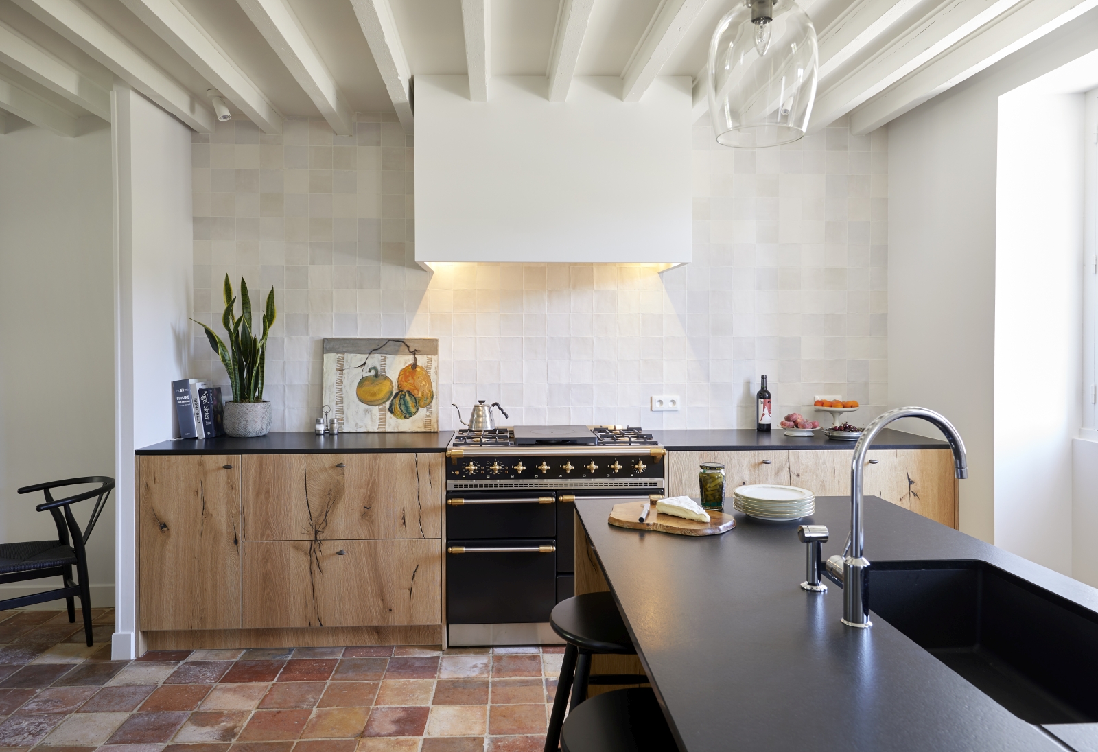 kitchen with full oven and beamed ceiling at pomiera, france