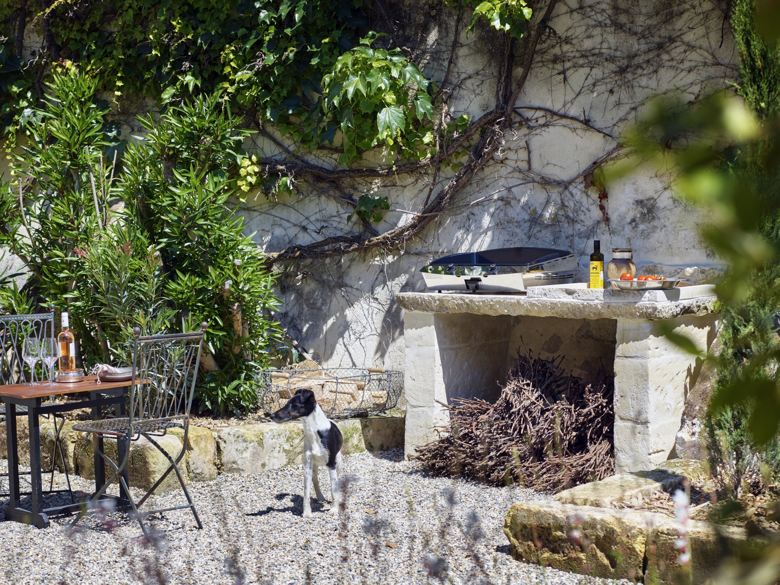 outdoor kitchen with large open fireplace at pomiera, france