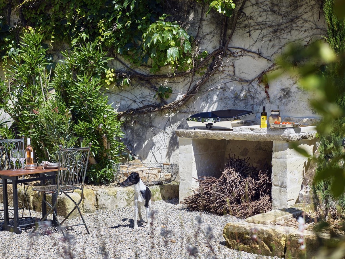 outdoor kitchen with large open fireplace at pomiera, france