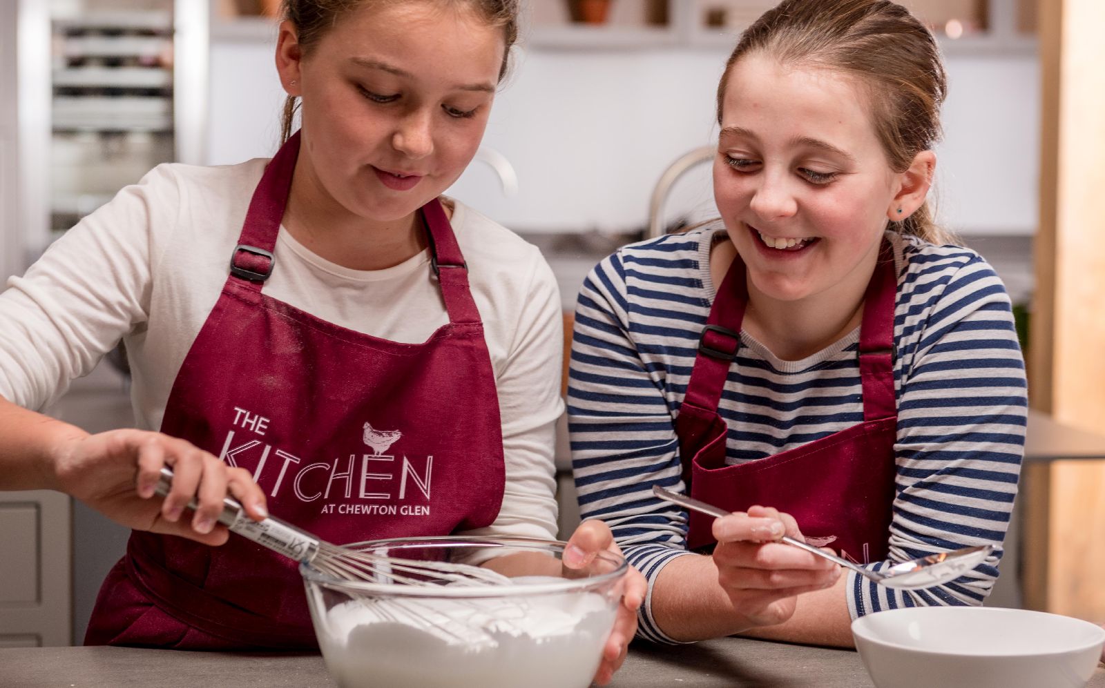 Children enjoying a cookery class at Chewton Glen in the New Forest UK
