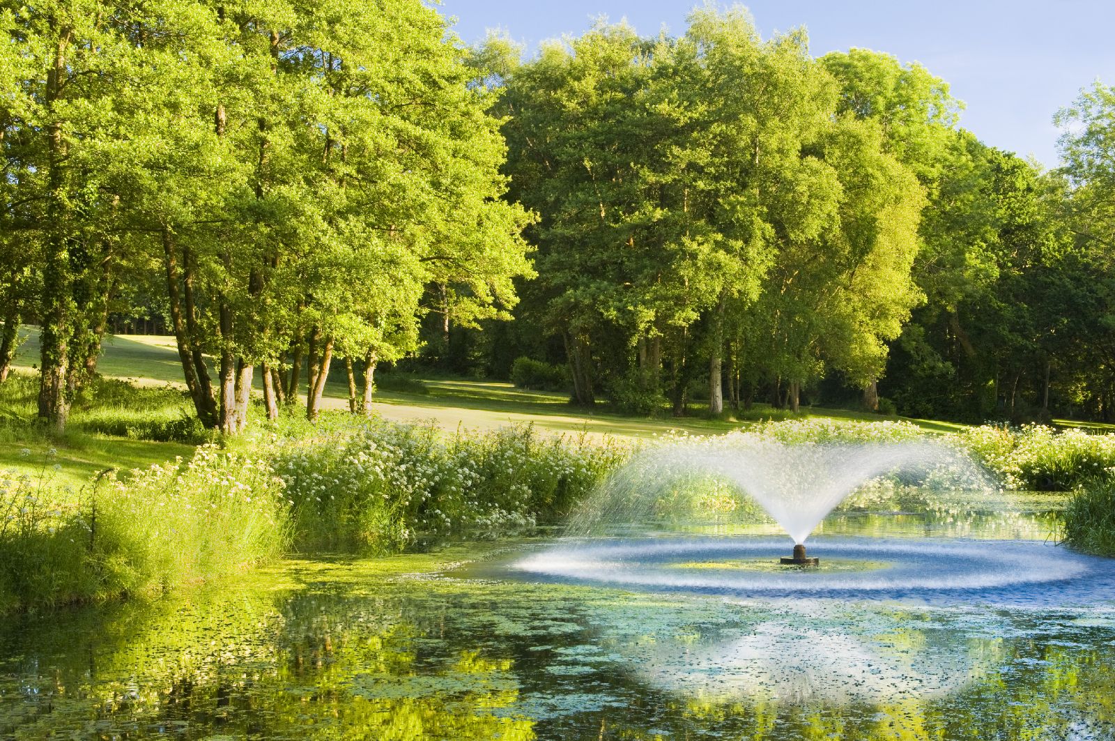 Lake and fountain in the grounds of at Chewton Glen in the New Forest UK