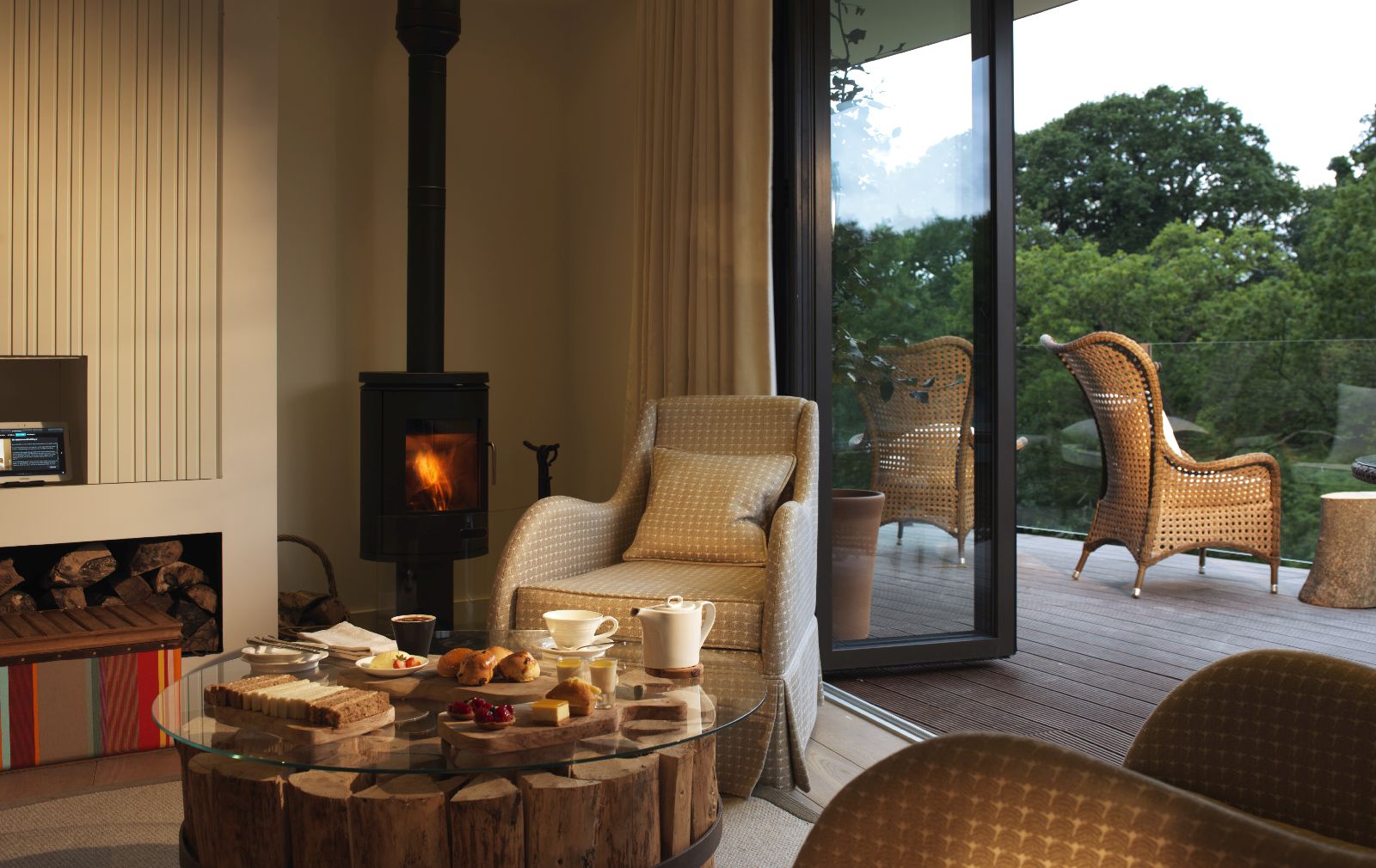 Living area and woodburner in a Treehouse at Chewton Glen in England