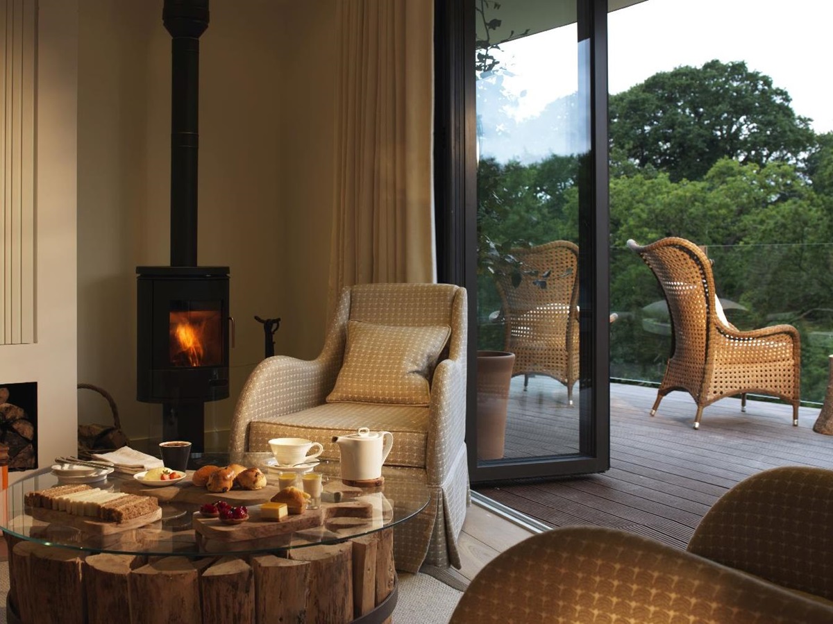 Living area and woodburner in a Treehouse at Chewton Glen in England