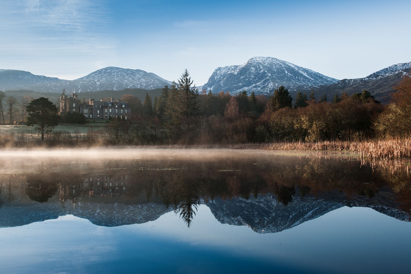 Inverlochy Castle Hotel in Scotland in the mist and lake views