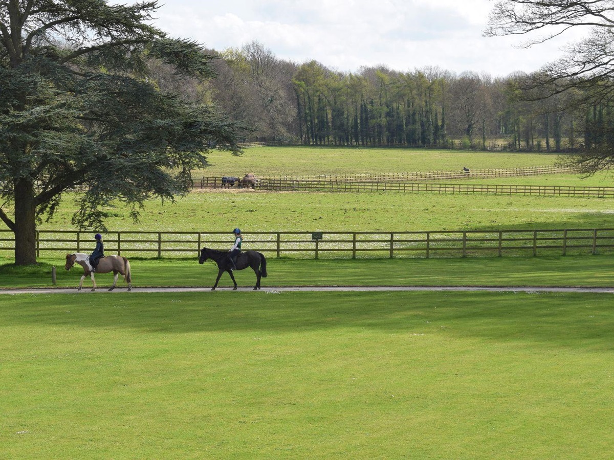 Guests enjoying horse riding at Lucknam Park hotel in the Cotswolds England