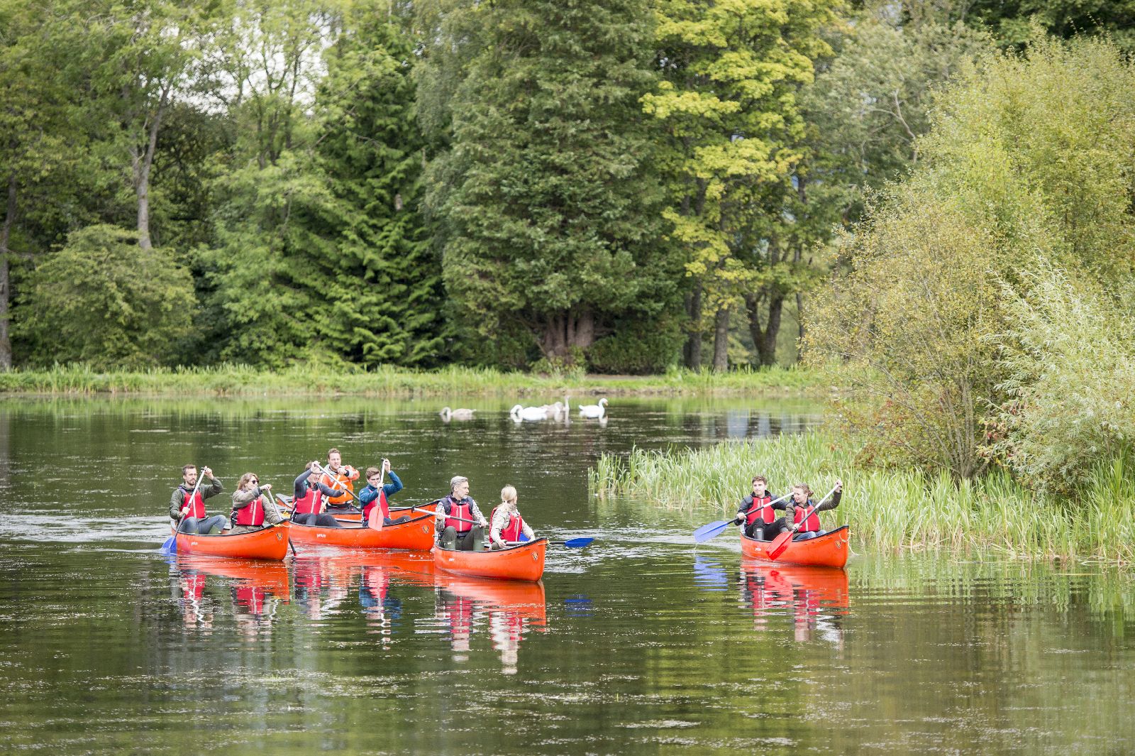 Guests canoeing in the beautiful countryside surrounding Gleneagles in Scotland