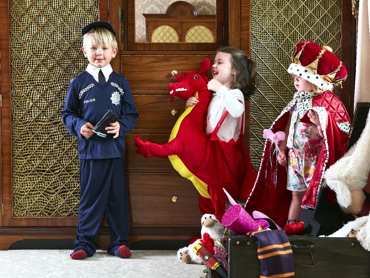 Children enjoying the dressing up box at The Goring hotel in London England