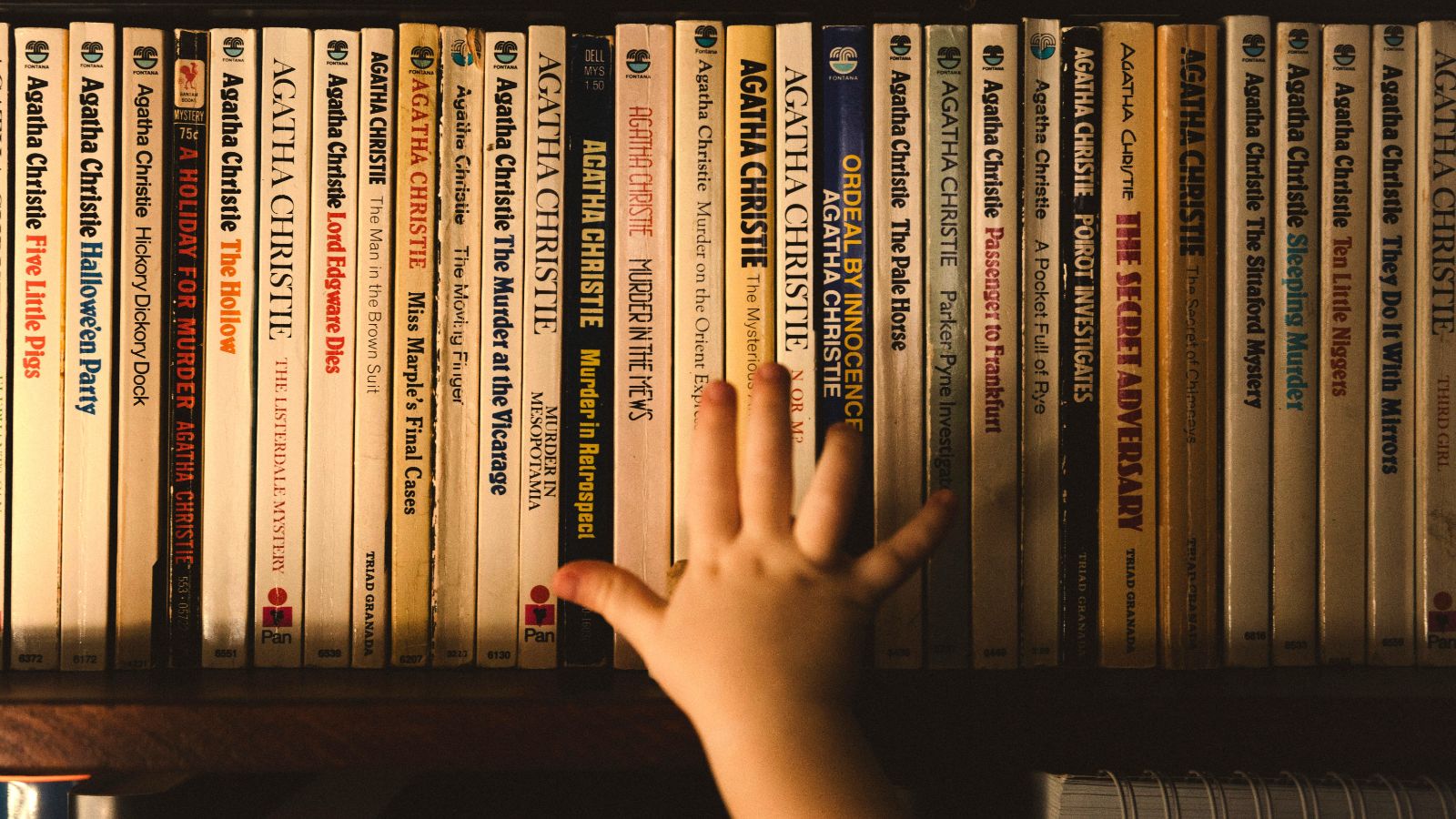Agatha Christie books on a bookshelf