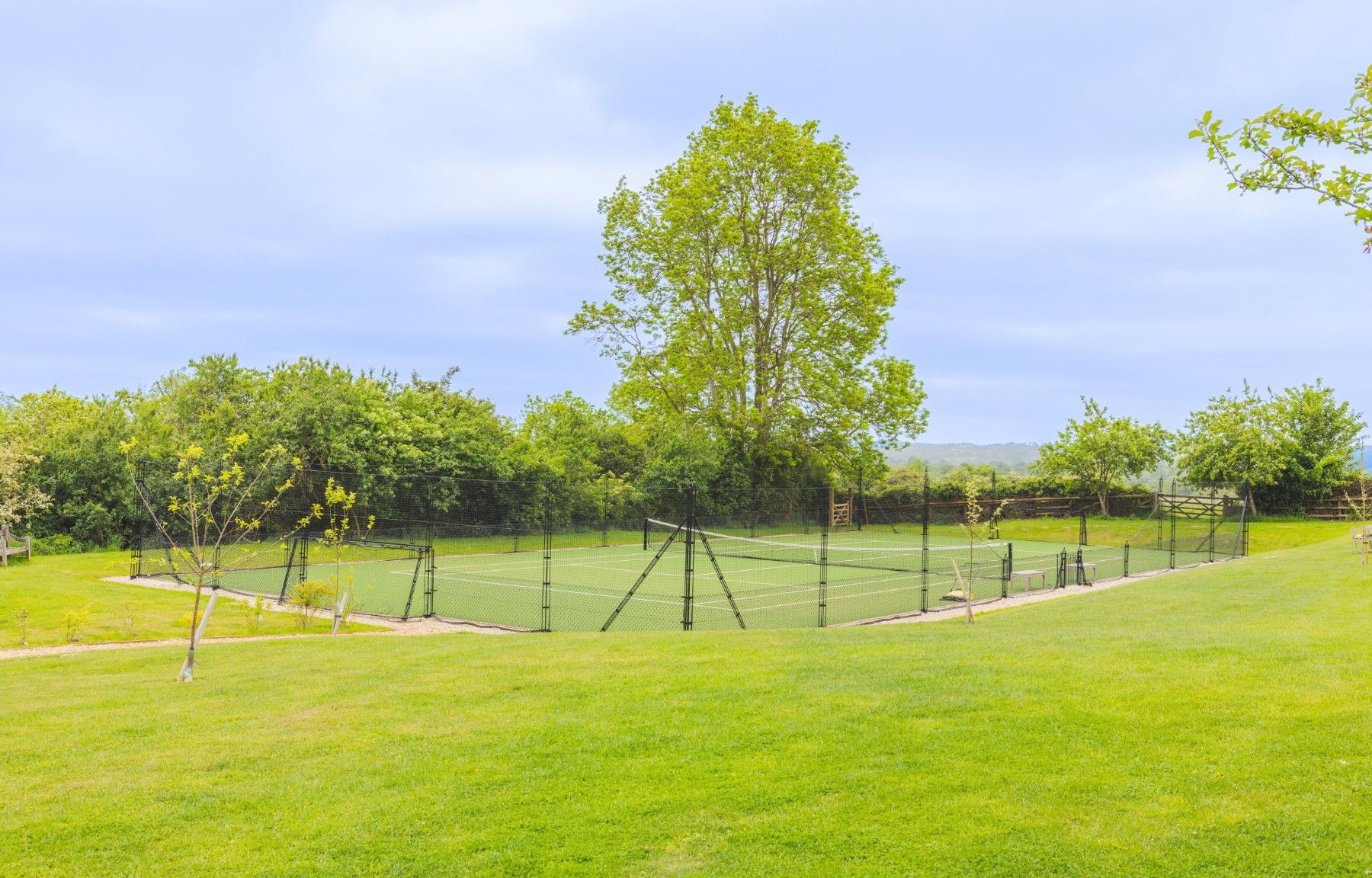 Tennis court at Oddington Farm in the Cotswolds, United Kingdom