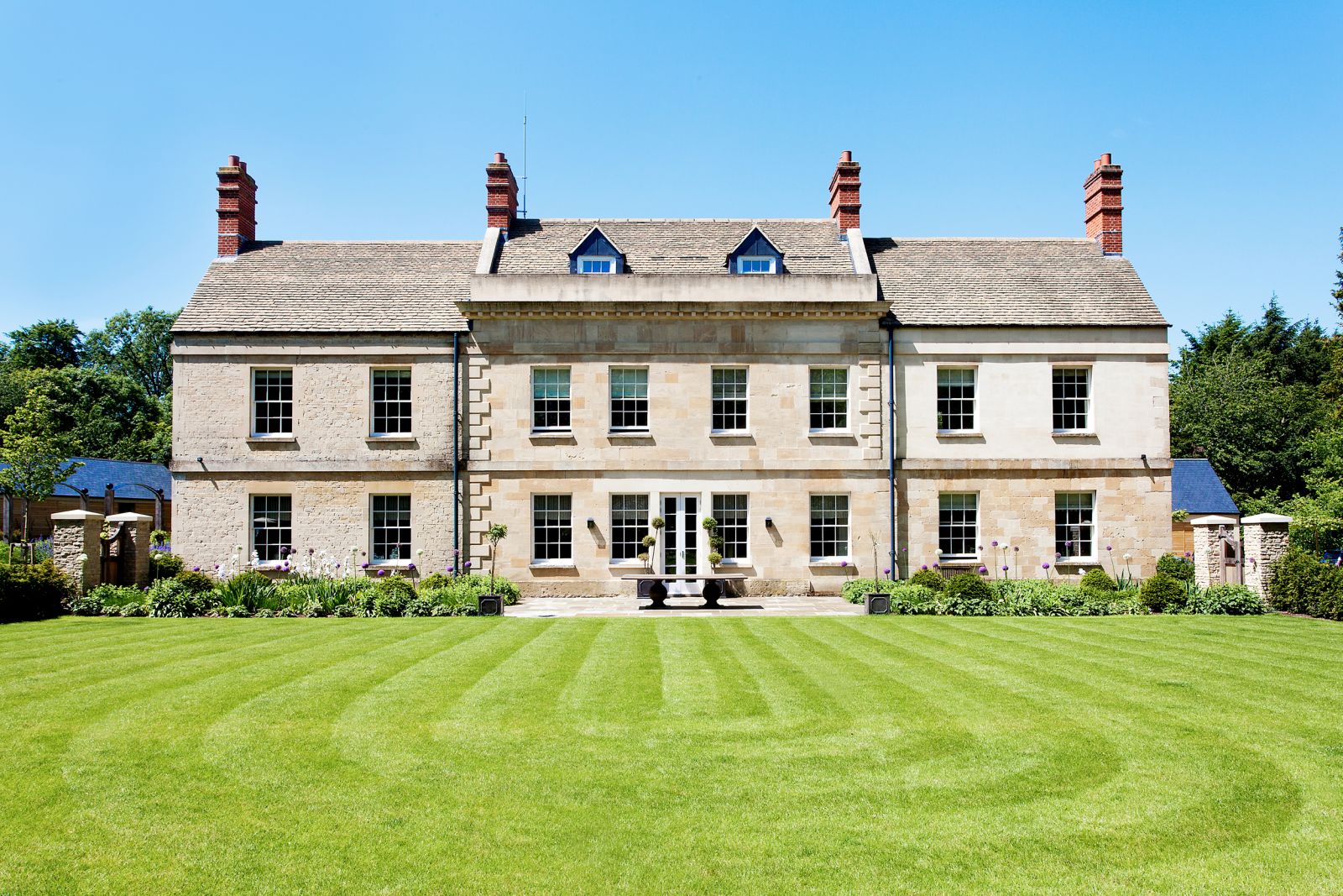 a view of the facade and the garden