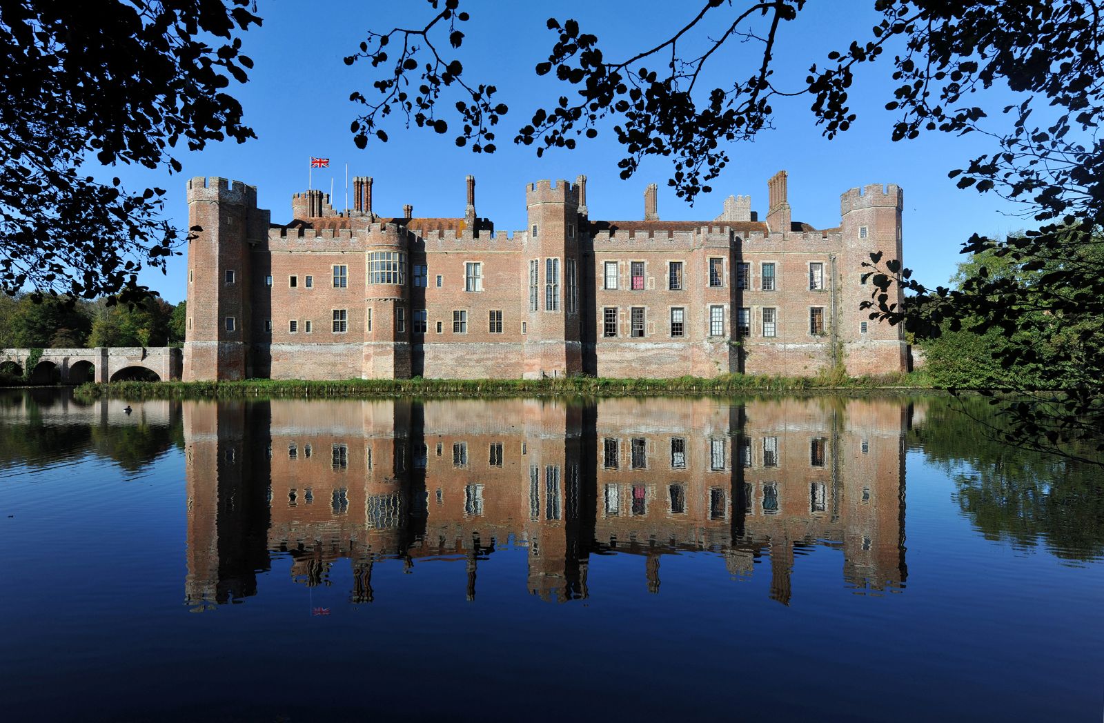 Herstmonceux House reflected on the lake in Sussex England