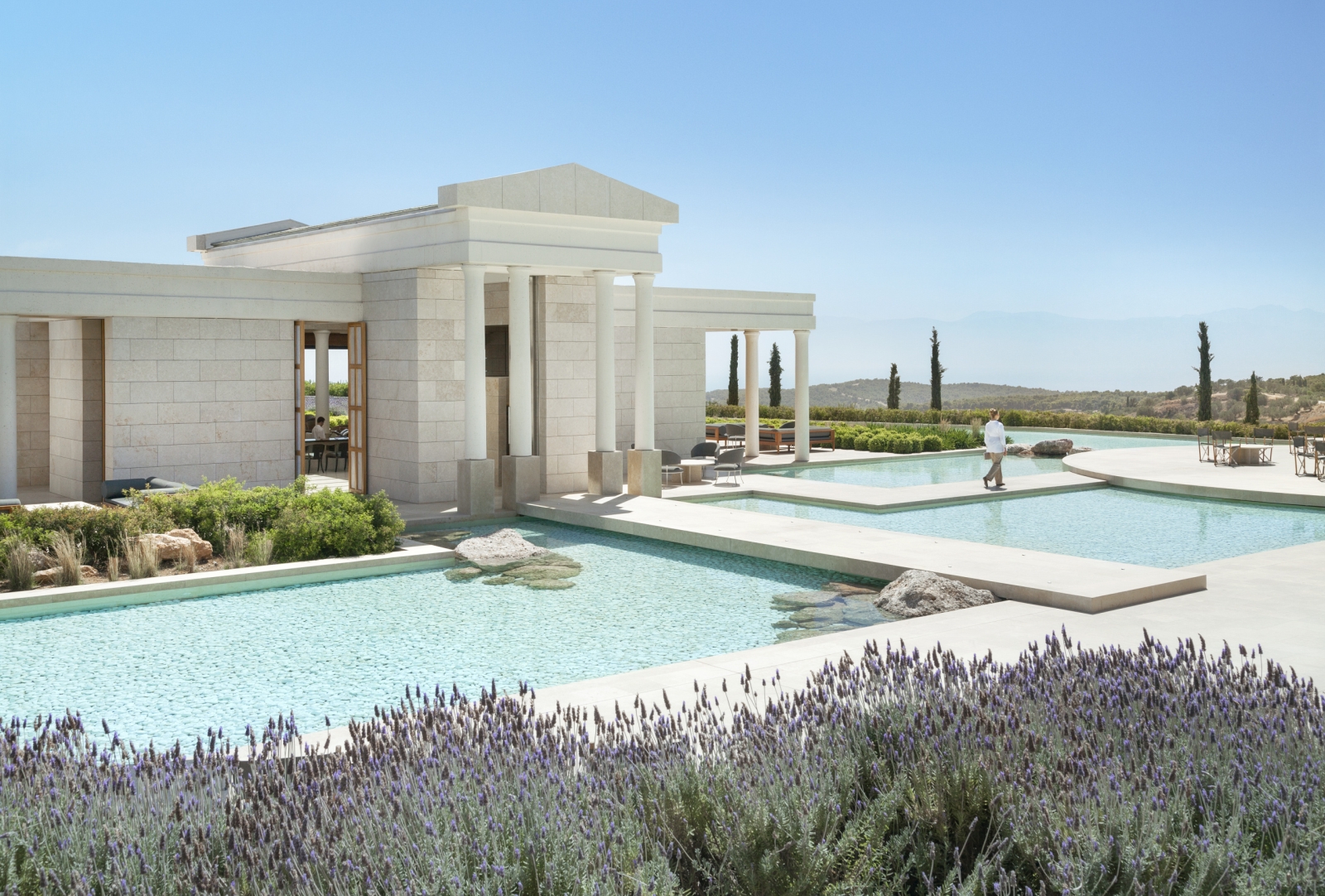 Ancient Greek style white building with pillars - the arrival pavilion at Amanzoe