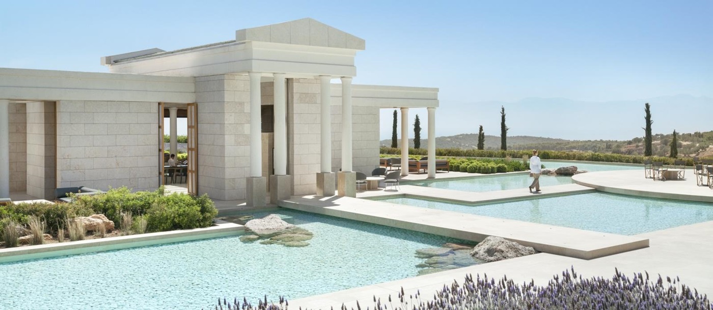 Ancient Greek style white building with pillars - the arrival pavilion at Amanzoe