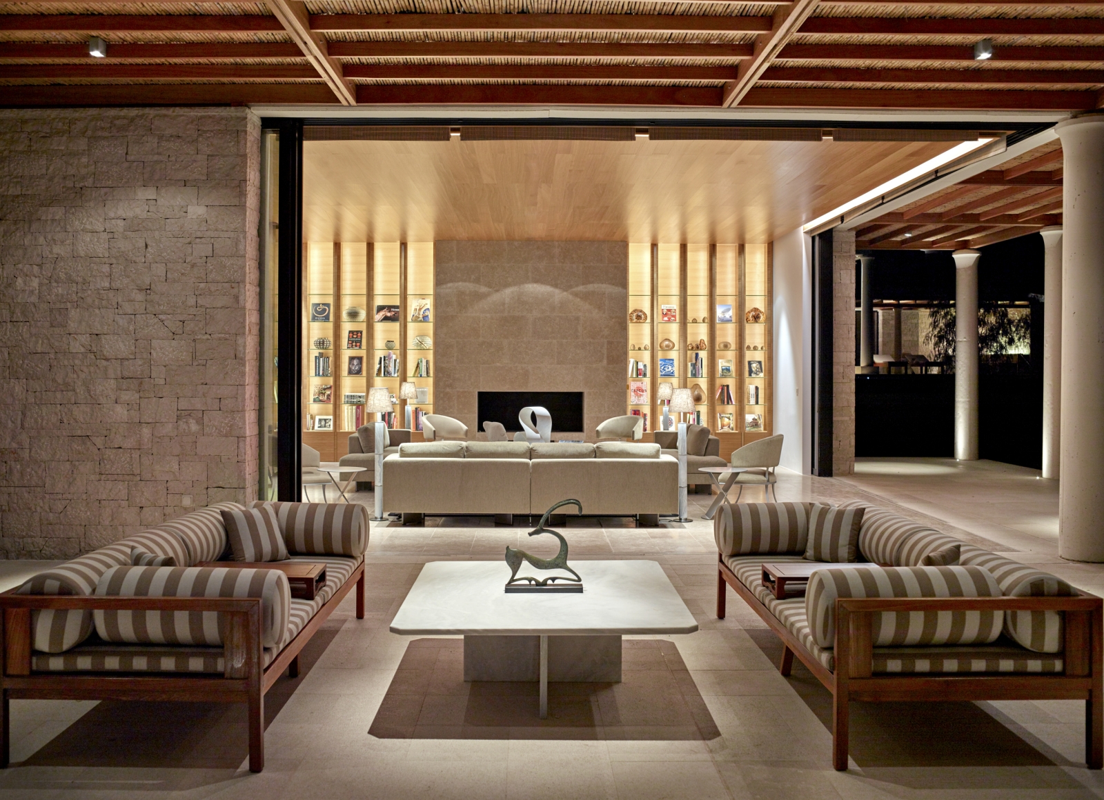 Library with comfortable sofas in a villa at Amanzoe