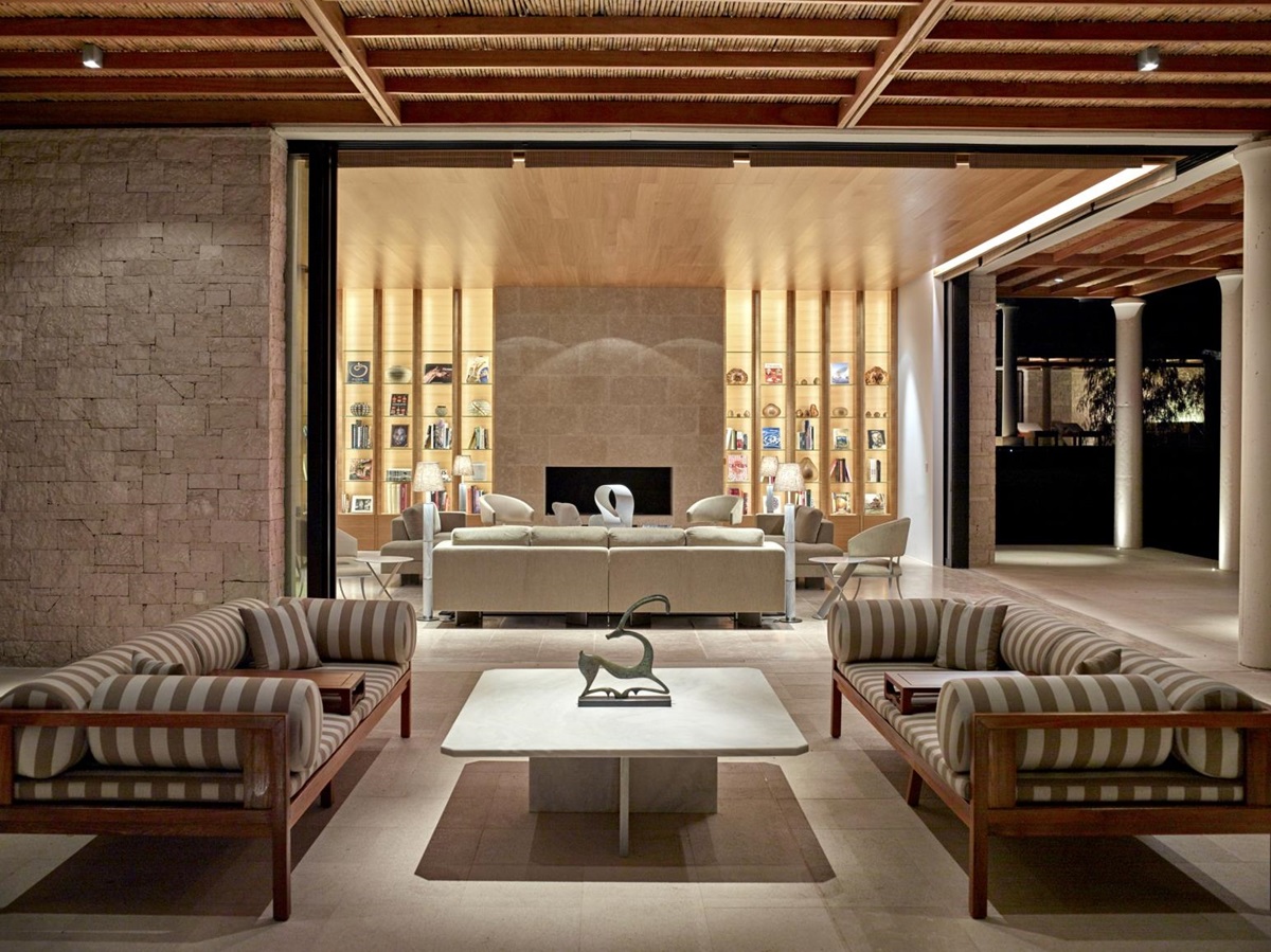 Library with comfortable sofas in a villa at Amanzoe
