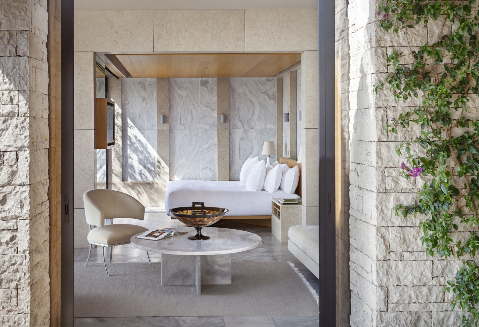 Bright bedroom and lounge of a Pavilion at Amanzoe